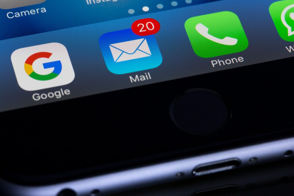 Close-up of a smartphone screen showing the Mail app with 20 unread messages, alongside Google, Phone, and WhatsApp icons—perfect for managing marketing emails and staying updated on search engine optimization news.