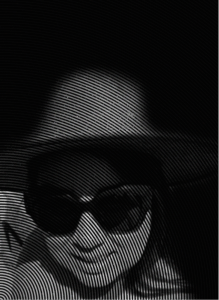 A person wearing dark sunglasses and a hat is shown in a black-and-white image with a wavy line overlay effect, evoking the mysterious world of digital marketing.