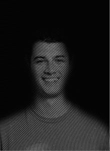 Black and white portrait of a person with concentric circular lines overlaying the image, creating a visual distortion effect—much like how effective SEO can subtly transform your digital presence against a dark background.