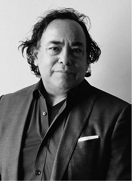 Black-and-white portrait of a middle-aged man with wavy hair, wearing a suit jacket, dress shirt, and pocket square, facing the camera against a plain background—perfect for marketing or CRM professional profiles.