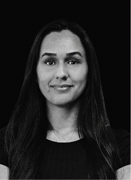 A woman with long dark hair and a slight smile is pictured against a plain black background, wearing a short-sleeved top—perfect for showcasing professional profiles in SEO or CRM industries.